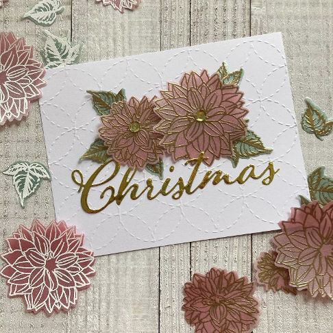 Colored vellum flowers on a handmade card