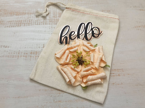 muslin gift bag with pink rose and hello in gold foil 