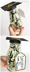 Graduation gift jar filled with money with graduate cap on top for the lid.