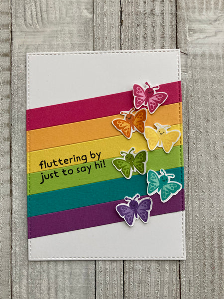 rainbow strips on a white background with butterfly stamps