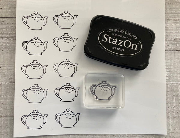 stamped teapots on shrink plastic