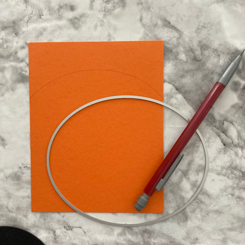 orange cardstock and a circle die traced to make a handmade Halloween card