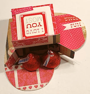 filling a valentine candy box with candy