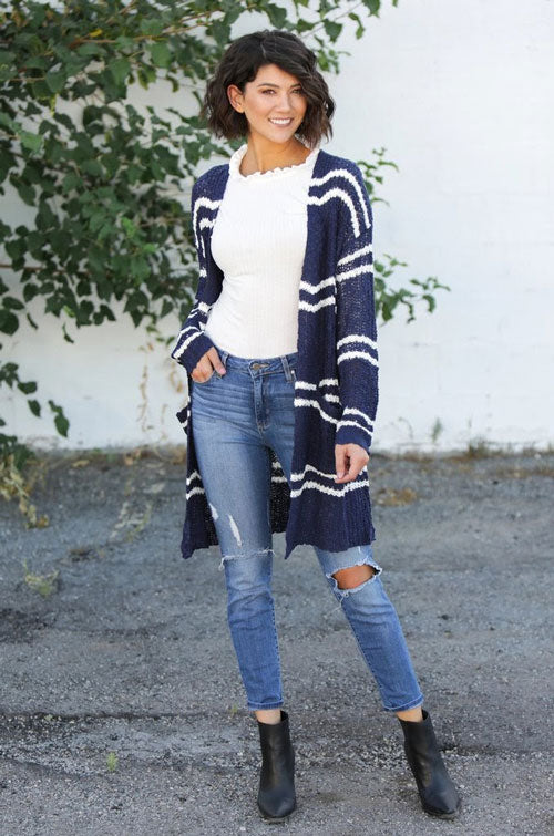 a blue cardigan with white stripes