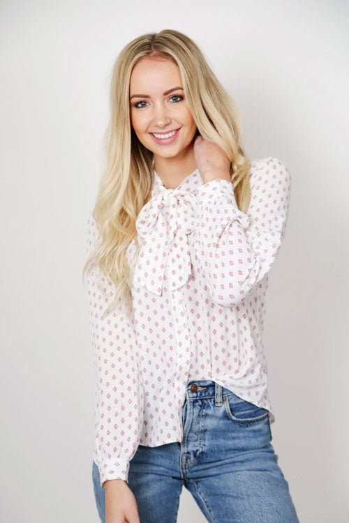 a diamond-patterned button-down top