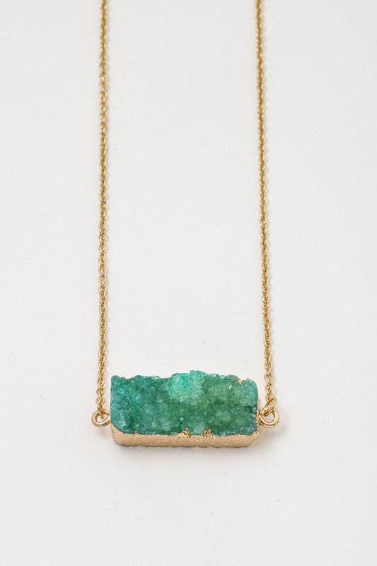 a green gemstone pendant necklace