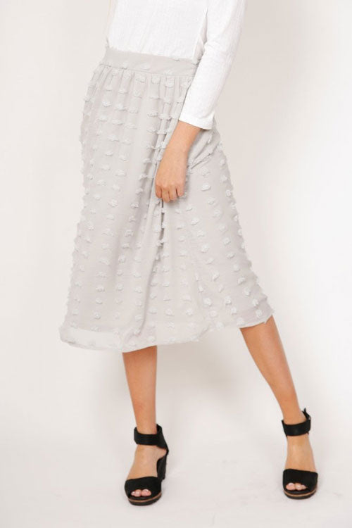 a grey Swiss dotted midi skirt