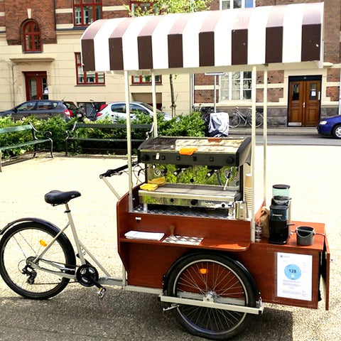 Trash bins in Copenhagen are angled so cyclists can toss their trash ...