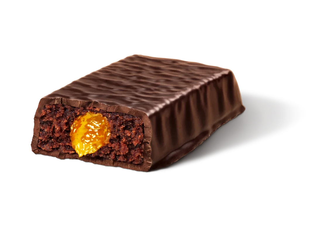 Chocolate bar with a gooey caramel center, partially cut open.