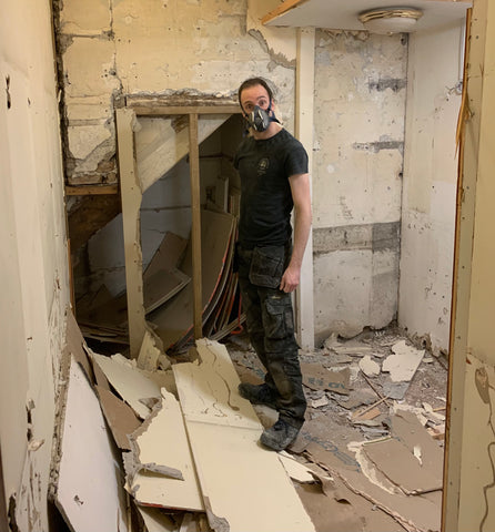 Josh clearing out what used to be the changing rooms and will now be a tavern themed room.