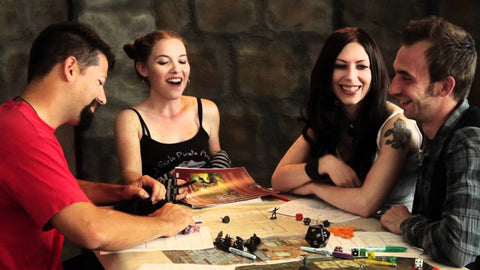 A party of young adults laughing and having fun while playing  Dungeons and Dragons