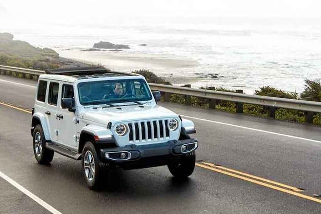 jeep driving down highway 1