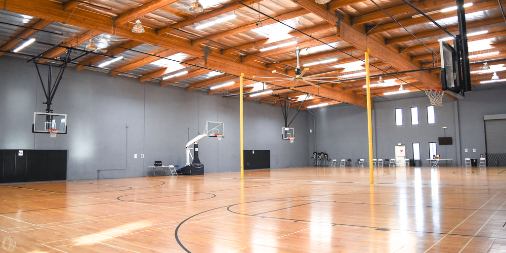 Basketball court with baskets and clean gym floor