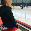 small child warm bum heating pack ice rink arena hockey