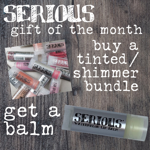 Tinted and Shimmer lip balms with white text that says they are the gifts of the month for April 2021