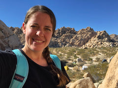 Image of Eliza Barlow outdoors in the mountains.