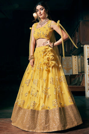 Photo of Offbeat bridal lehenga in yellow and maroon