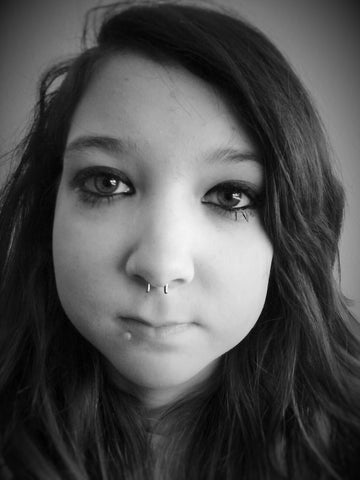 picture of girl wearing flip up septum retainer