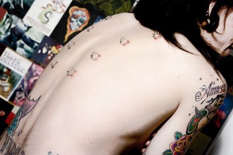 girl getting a corset piercing src wikipedia commons