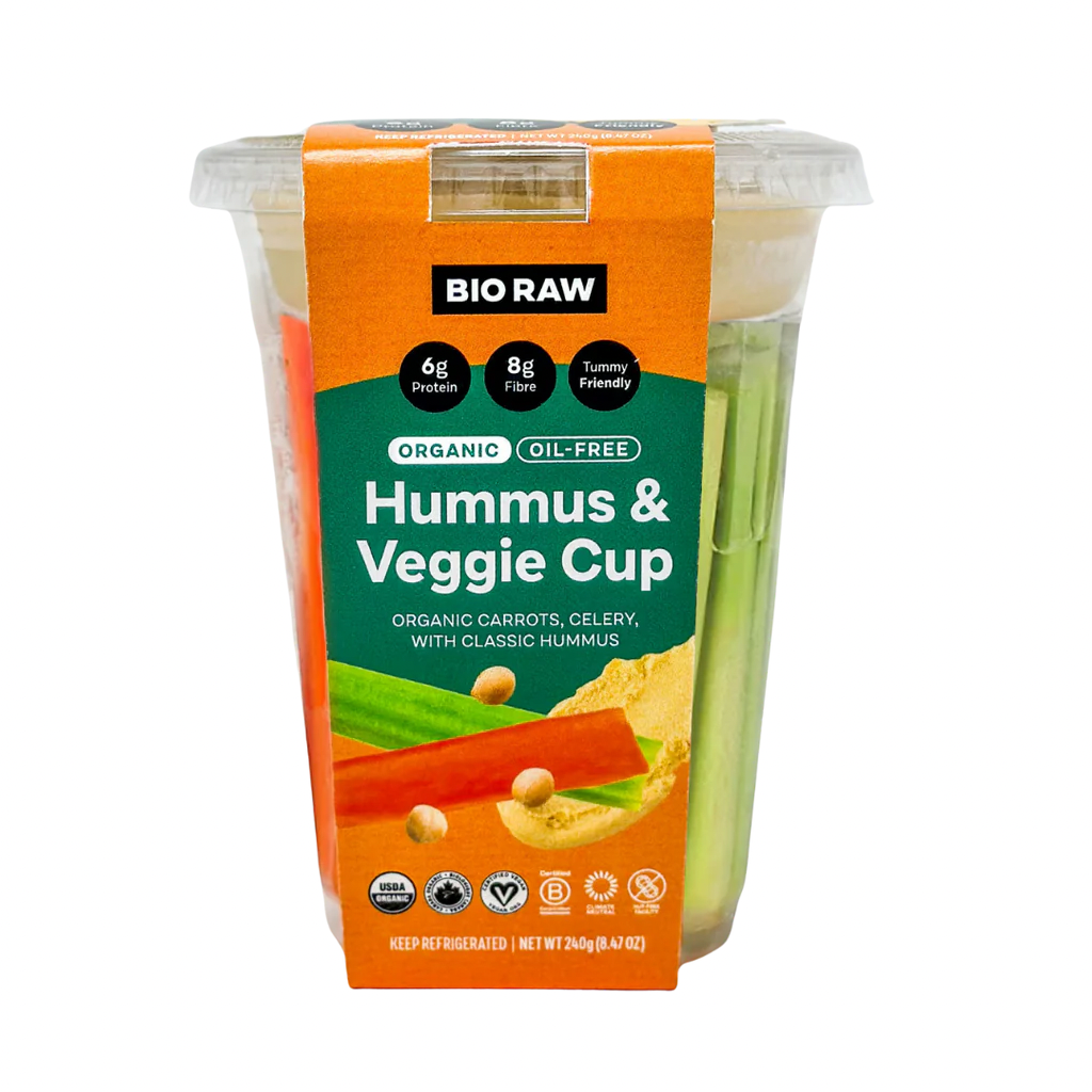 Packaged hummus and veggie cup with carrot and celery sticks.