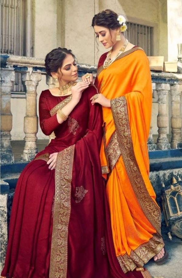 Women in Red & Yellow Sarees