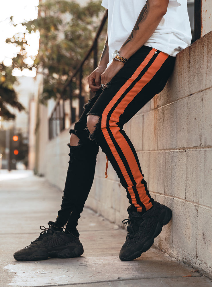 black and orange jeans