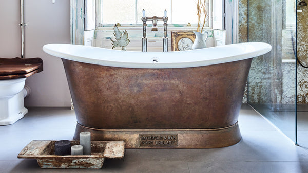 copper bateau bathtub in a bathroom