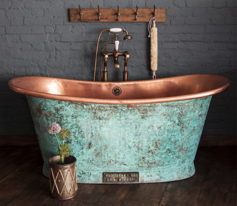 a copper bathtub for a small space bathroom