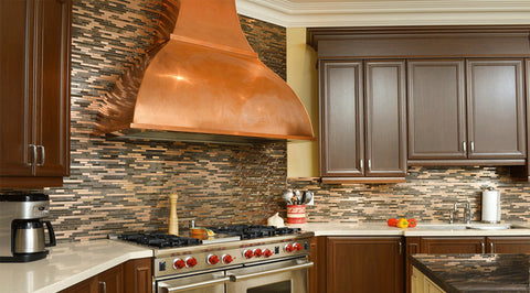 copper vent hood installed as wall mount in a kitchen