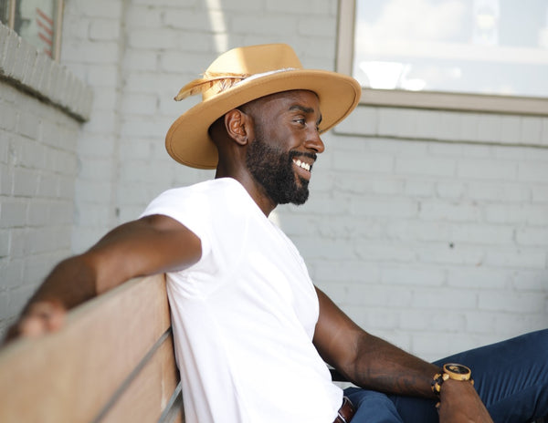 Black man wearing fedora hat