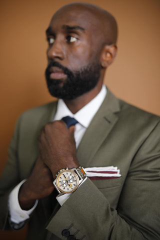 Man In Suit and Timepiece