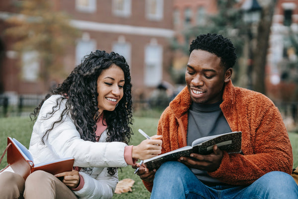 black friends sitting and reading