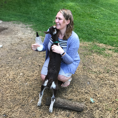 Megan cuddles baby goat