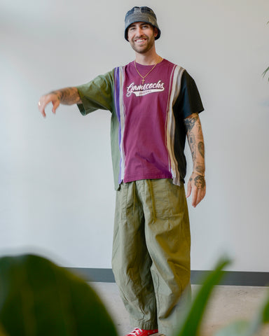 Model wearing Rebuild by Needles H.D. pants and bucket hat