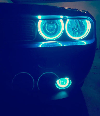 A Dodge Challenger features ORACLE's blue halo headlights and fog lights.