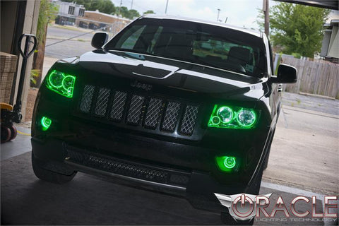 A black Jeep with green halo headlights