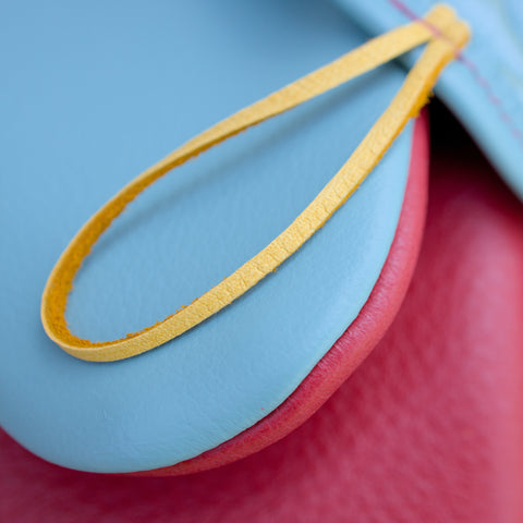 oven mitt seafoam blue green and poppy red leather detail close up