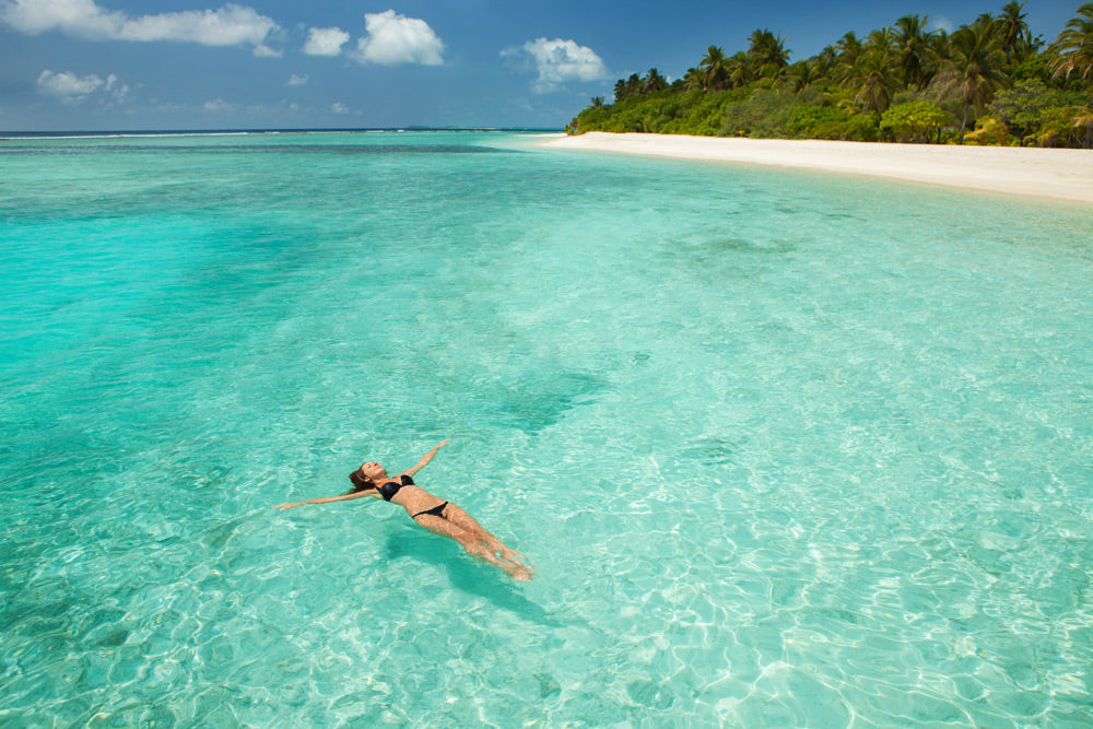 bigstock-Woman-swim-and-relax-in-the-se-170335655