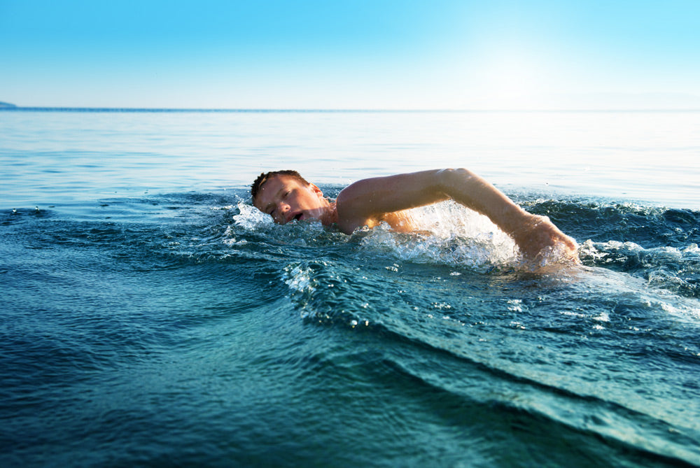 bigstock-young-man-swimming-in-oceans-w-12752129