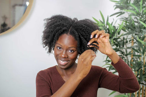 Afrocenchix How to do the PERFECT Twist out on Natural Hair: Beautiful black woman with afro hair unravelling her twists