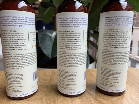 Lockdown afro hair care: back of three Afrocenchix bottles showing the ingredients list