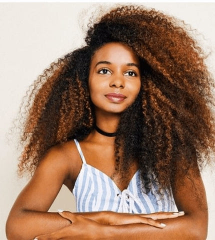 Young woman with side parted long natural hair