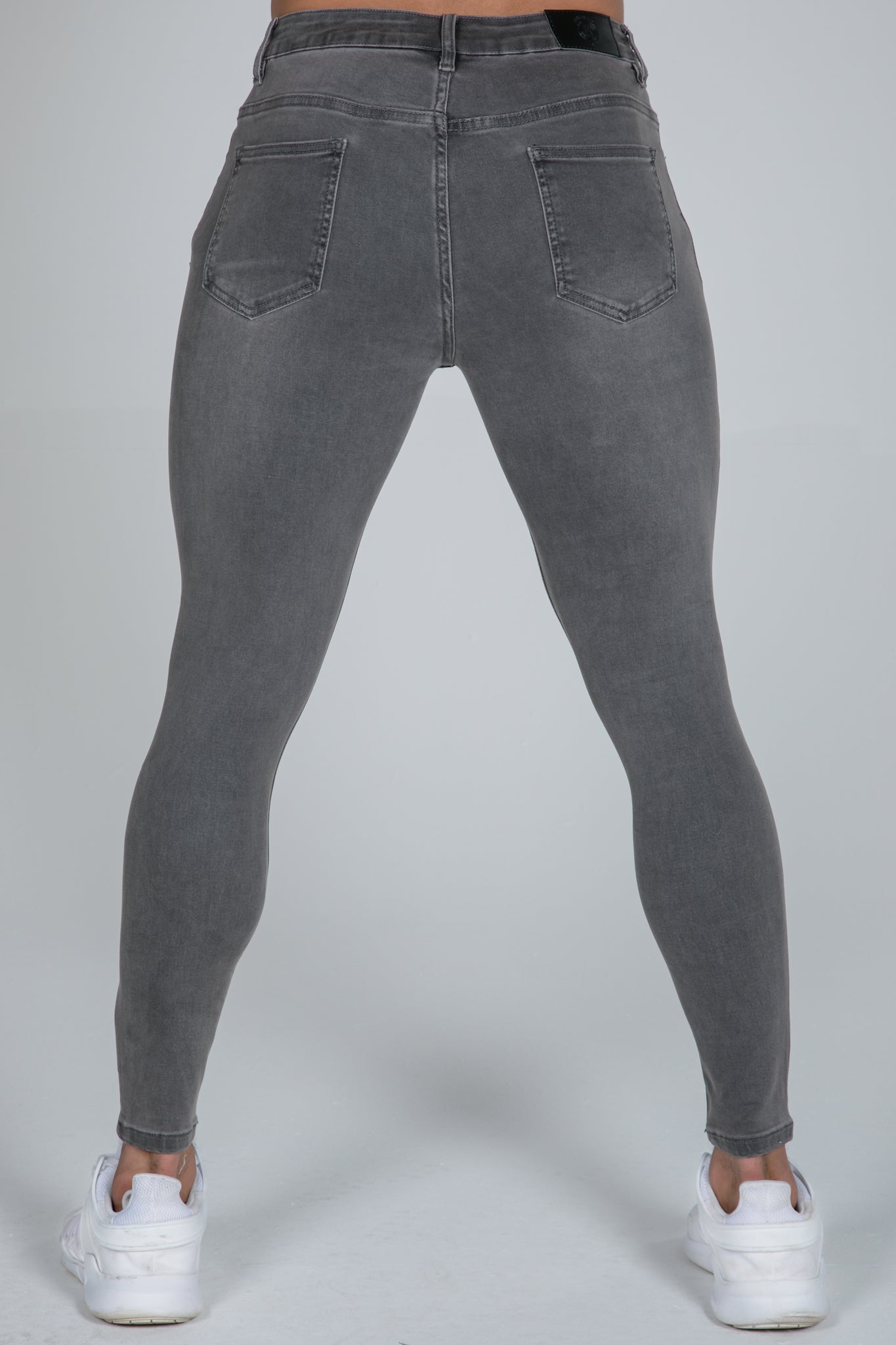 spray on grey jeans