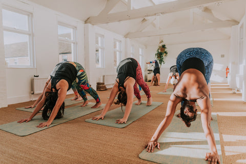 How to do a downward facing dog pose in yoga. Blossom Yoga Wear Eco friendly yoga wear for the fashion conscious yogi