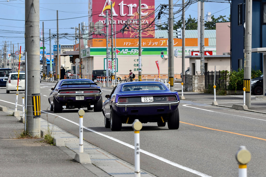 Classic Mopar car and Camaro Rearview