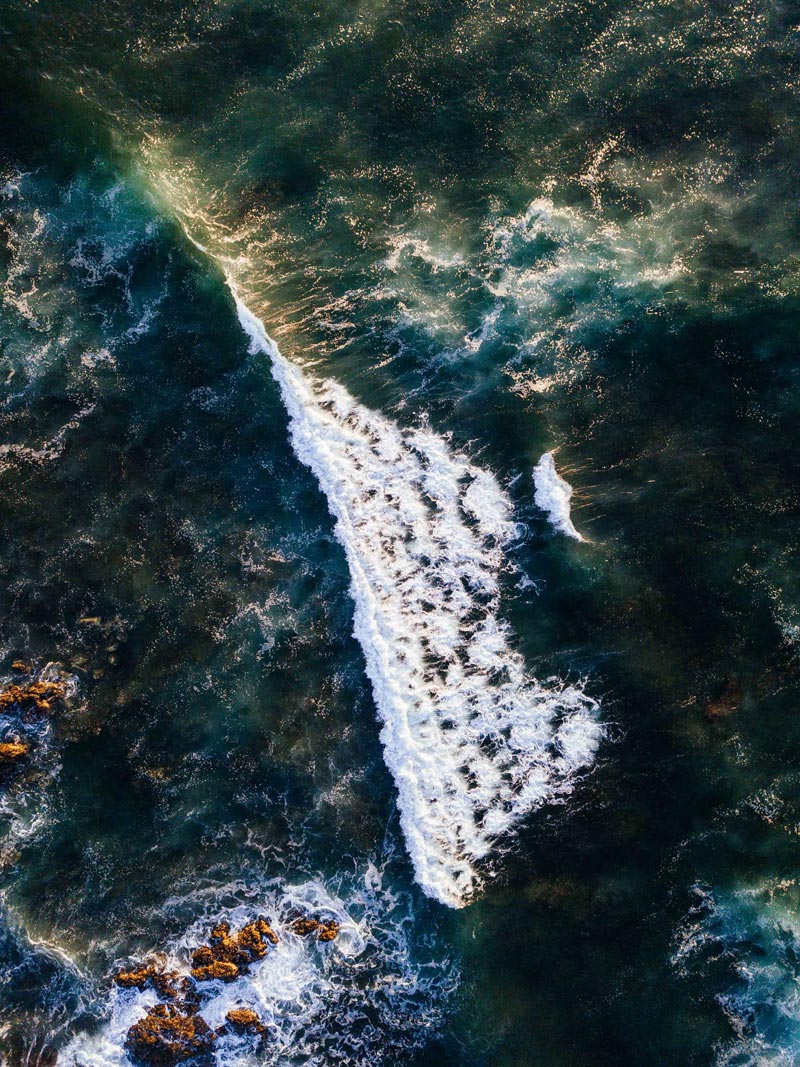 Aerial photograph of turquoise wave breaking in Costa Rica. Fine art aerial photography print Photographed by Kristen M. Brown, Samba to the Sea for The Sunset Shop.