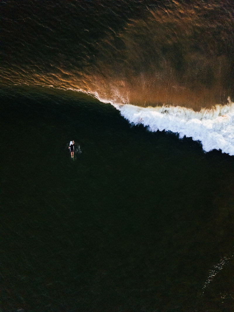 Aerial photo of waves breaking in Tamarindo Costa Rica. Photographed by Kristen M. Brown, Samba to the Sea for The Sunset Shop.