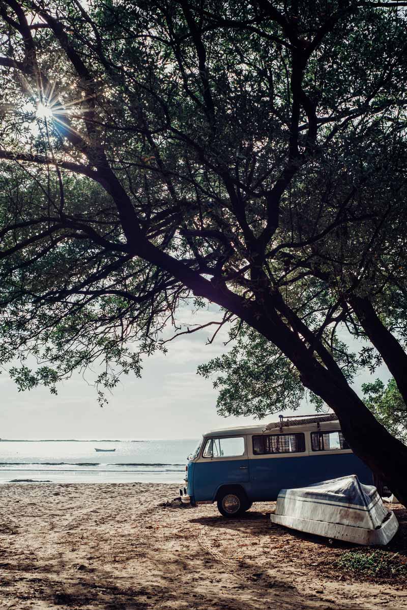 VW bus on the beach in Tamarindo Costa Rica. Photographed by Kristen M. Brown, Samba to the Sea for The Sunset Shop.