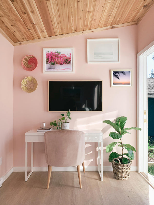 Work from home office with all the beach vibes. Lindsay from Sincerely Lindsay Design Co. created a dreamy backyard office space with the help of sunset and beach photo wall art photographed by Kristen M. Brown of Samba to the Sea. Beach photo prints available at The Sunset Shop.