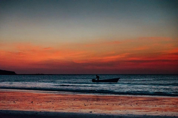 Fisherman sunset in Tamarindo, Costa Rica. Photographed by Kristen M. Brown, Samba to the Sea. Sunset print at The Sunset Shop.